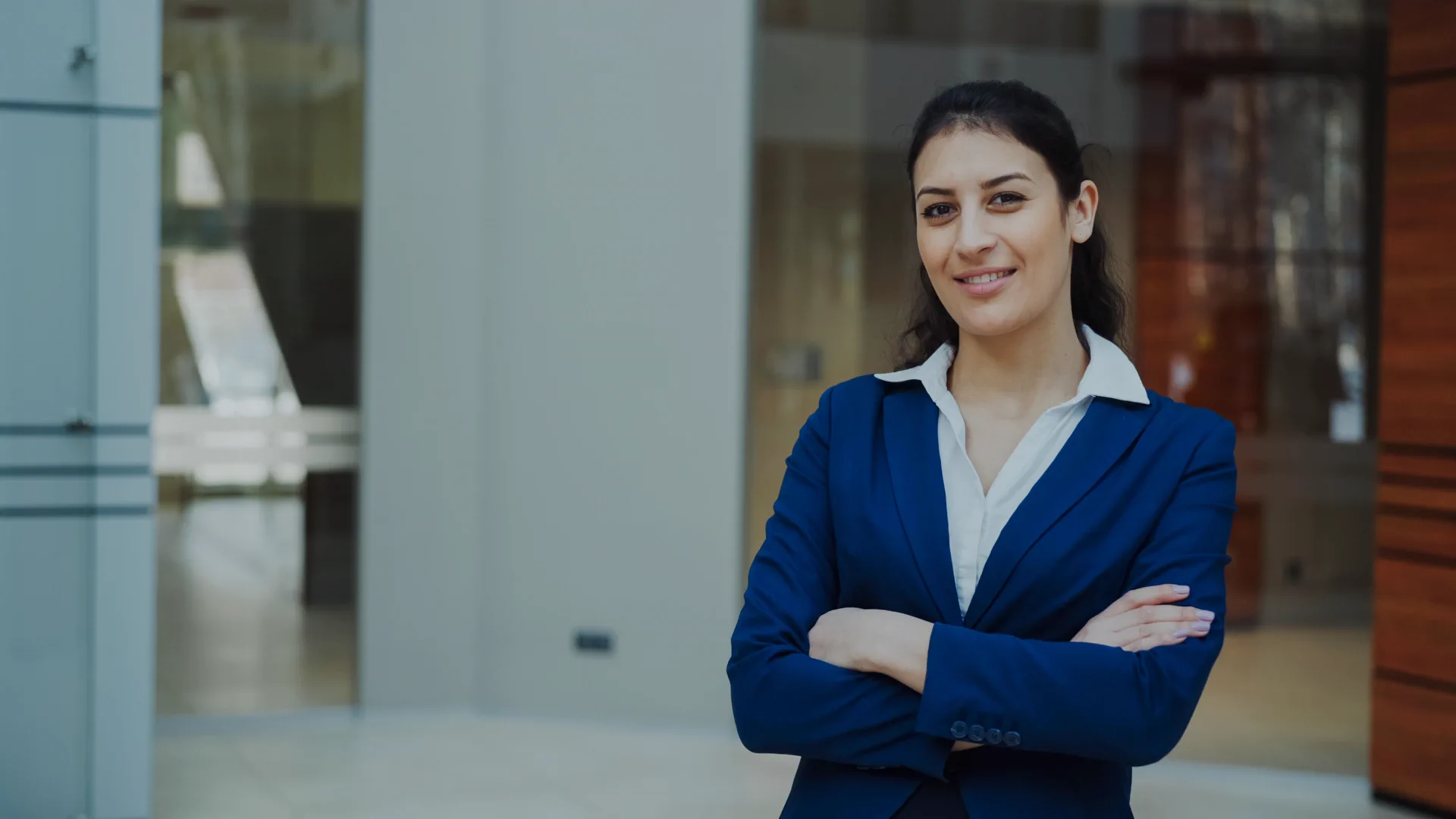 Confident professional woman in a corporate office representing FraserExam securities exam success
